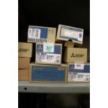 Ten boxes of Mitsubishi various electrical items/components.