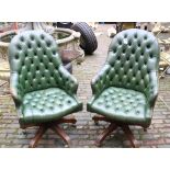 Pair of green leather button back swivel armchairs: on wooden base with brass castors (2).