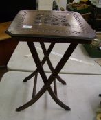 An Anglo-Indian style carved folding occasional table: 61cm in height.