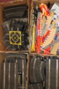 A large quantity of Scalextric track and accessories: (4 trays).