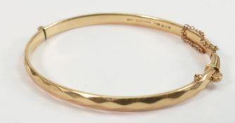 9ct gold bangle with solid metal core: Gross weight 14.5 grams, but be mindful that this is mostly