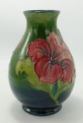 Moorcroft Hibiscus on Green Ground vase: height 19cm( damaged repair to neck)