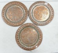 Three Early 20th Century Heavy Islamic Theme Hand Beaten Copper Plates: diameter of each 37cm(3)