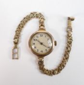 9ct gold watch and 9ct bracelet: Gross weight 25.2g. Winds, ticks & runs.