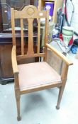 Oak Art Nouveau style high back armchair, circa 1910. H: 119.5cm, W: 56cm, D: 57cm.