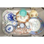 A collection of Oriental plates and bowls including: 19th Century items, blue & white pot lid, tea