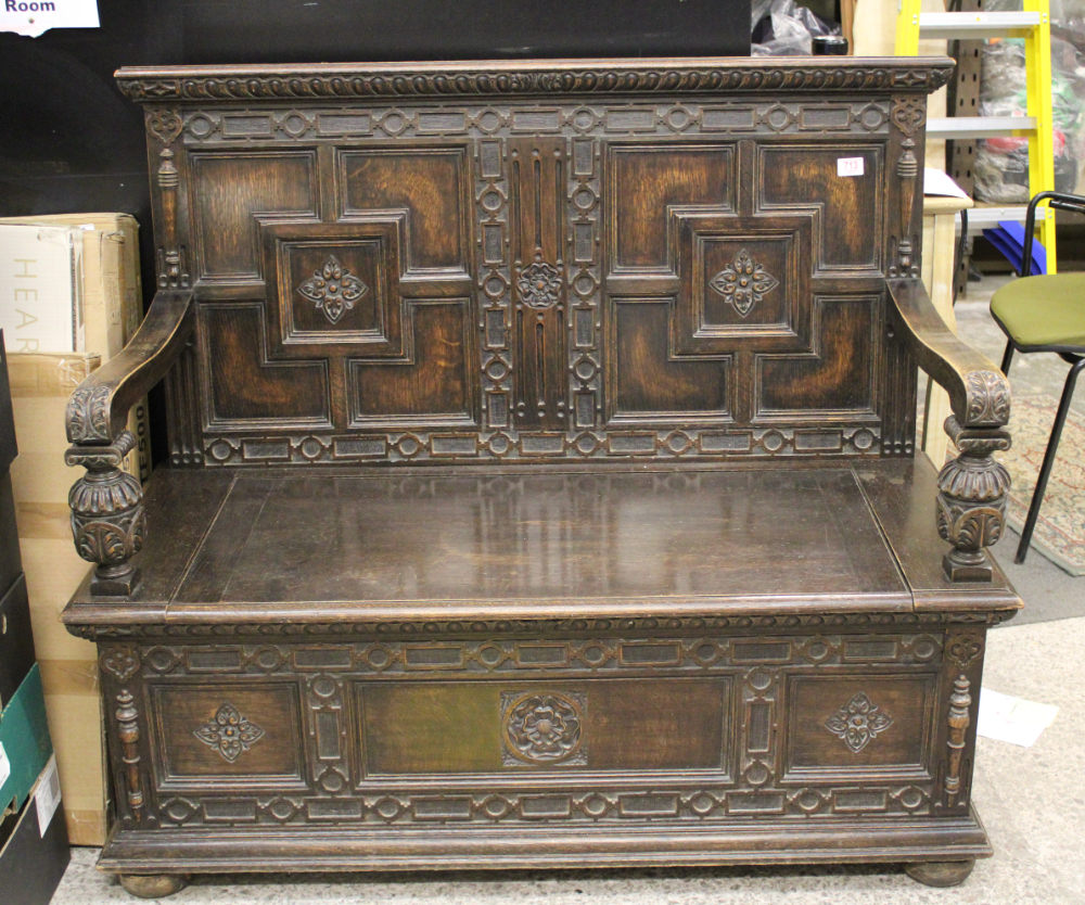 Early 20th Century dark oak monks bench: by Jones moss, & Co Newcastle under Lyme. 122cm wide x 60cm