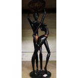 A very large African hardwood hand carved figure of tribal man and lady: 64cm in height.