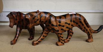 Two African hardwood hand carved figures of big cats: 46cm in length.