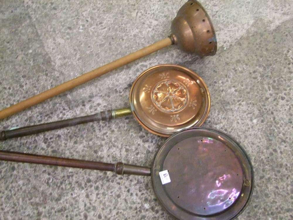 Two bed warming pans together with a laundry copper (Simplex No 2) long handled plunger (3)