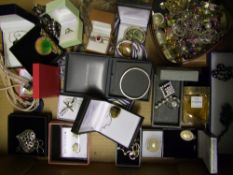 A good collection of costume jewellery to include necklaces, rings, brooches etc, silver items noted