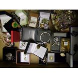 A good collection of costume jewellery to include necklaces, rings, brooches etc, silver items noted