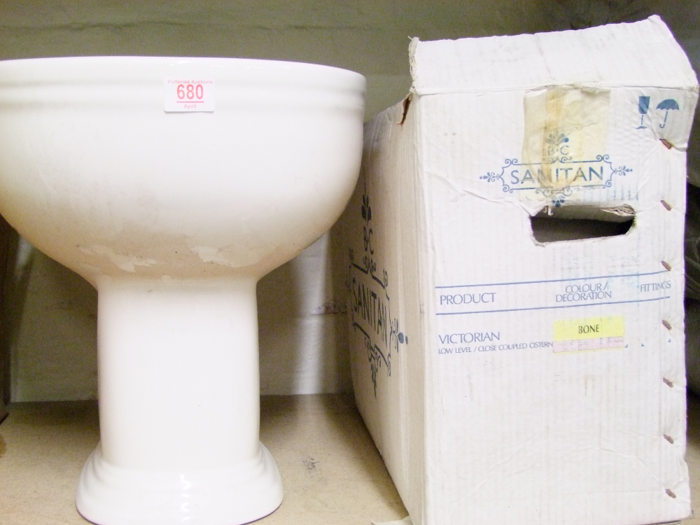 Sanitan branded toilet base and cistern: