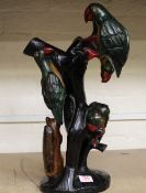 A very large African hardwood hand carved figure of a group of parrots on tree stump: 49cm in