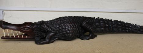 A very large African hardwood hand carved figure of a crocodile: 100cm in length.