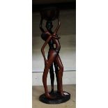 A very large African hardwood hand carved figure of tribal man and lady: 57cm in height.