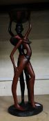 A very large African hardwood hand carved figure of tribal man and lady: 57cm in height.