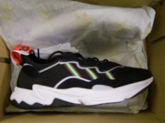 A boxed pair of Adidas Ozweego trainers: size 12.