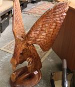 A very large African hardwood hand carved figure of an eagle and snake: 80cm in height.