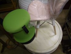 Circular white washed coffee table: together with a green stool and pink upholstered chair