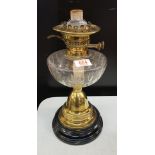 An Edwardian brass and glass oil lamp: no shade or chimney, 40cm in height.