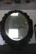 Oak carved framed bevel mirror: 88cm x 62.5cm