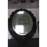 Oak carved framed bevel mirror: 88cm x 62.5cm