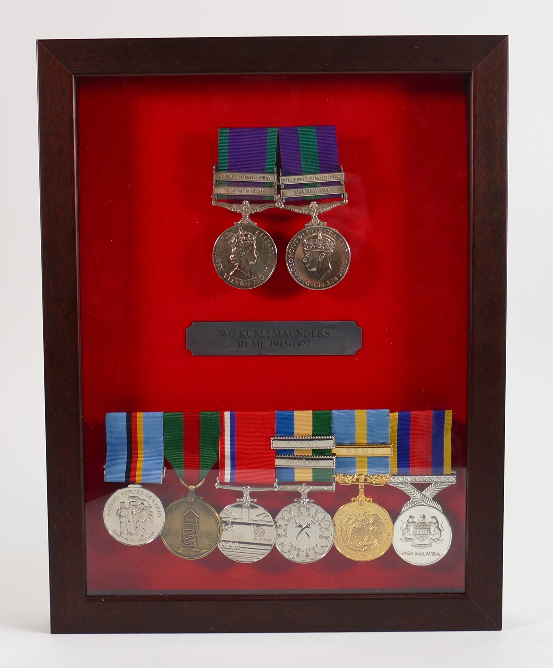 A collection of medals awarded to H Maunders: Comprising Elizabeth General Service medal with Borneo