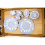 A collection of Wedgwood Blue Jasperware to include: plates, vases & lidded boxes