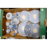 A collection of Wedgwood Blue Jasperware to include: Christmas plates, vases, lidded pots, salt &