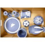 A collection of Dark Blue Wedgwood Jasperware including: candlesticks, tobacco jar, lidded pot &