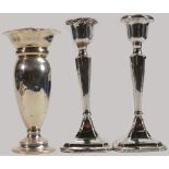 Silver large vase and pair of silver candlesticks: All filled, gross weight 586g. (3)