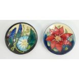 Two Moorcroft Floral Decorated Coasters: both marked seconds, each diameter 12cm(2)