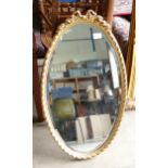 Gilt Effect Ribbon Topped Oval Wall Mirror: height 74cm