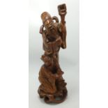 Oriental Carved Wooden Figure: height 33cm