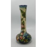 Moorcroft bud vase in the Sweet Briar pattern: Measures 20.5cm high. Slight localised crazing to