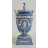 Wedgwood Jasperware handled urn and cover: With classical decoration, height 30cm.