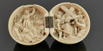 18/19th century Dieppe carved Ivory Diptych with religious scene: Diameter 6cm. Please note that