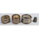 Three silver hallmarked napkin rings & silver thimble: Gross weight 51g.