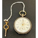 Ladies silver pocket watch: working order with key.