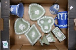 A collection of Wedgwood Sage Green & Blue Jasperware including: pin trays, small urns, lidded