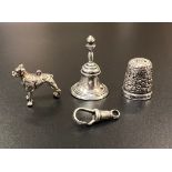 A mixed collection of silver items: thimble, dog pendant, bell etc 18g total weight.