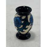 Moocroft miniature vase: decorated with blue flower. Boxed