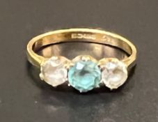 An 18ct ladies gold ring with clear and coloured stones: 2.9g.