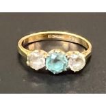 An 18ct ladies gold ring with clear and coloured stones: 2.9g.