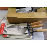 Nine 11" brick trowels: Philadelphia pattern. Brand new