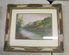20th Century framed watercolour: of a waterside scene . Signed but signature indistinct . 62cm x