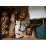 A mixed collection of items to include: resin animal figures, owls, resin cottage etc ( 1 tray)