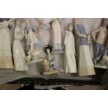 A collection of 9 Lladro style figures: