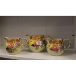 Graduated Set of Hand decorated Arthur Woods Jugs: height of tallest